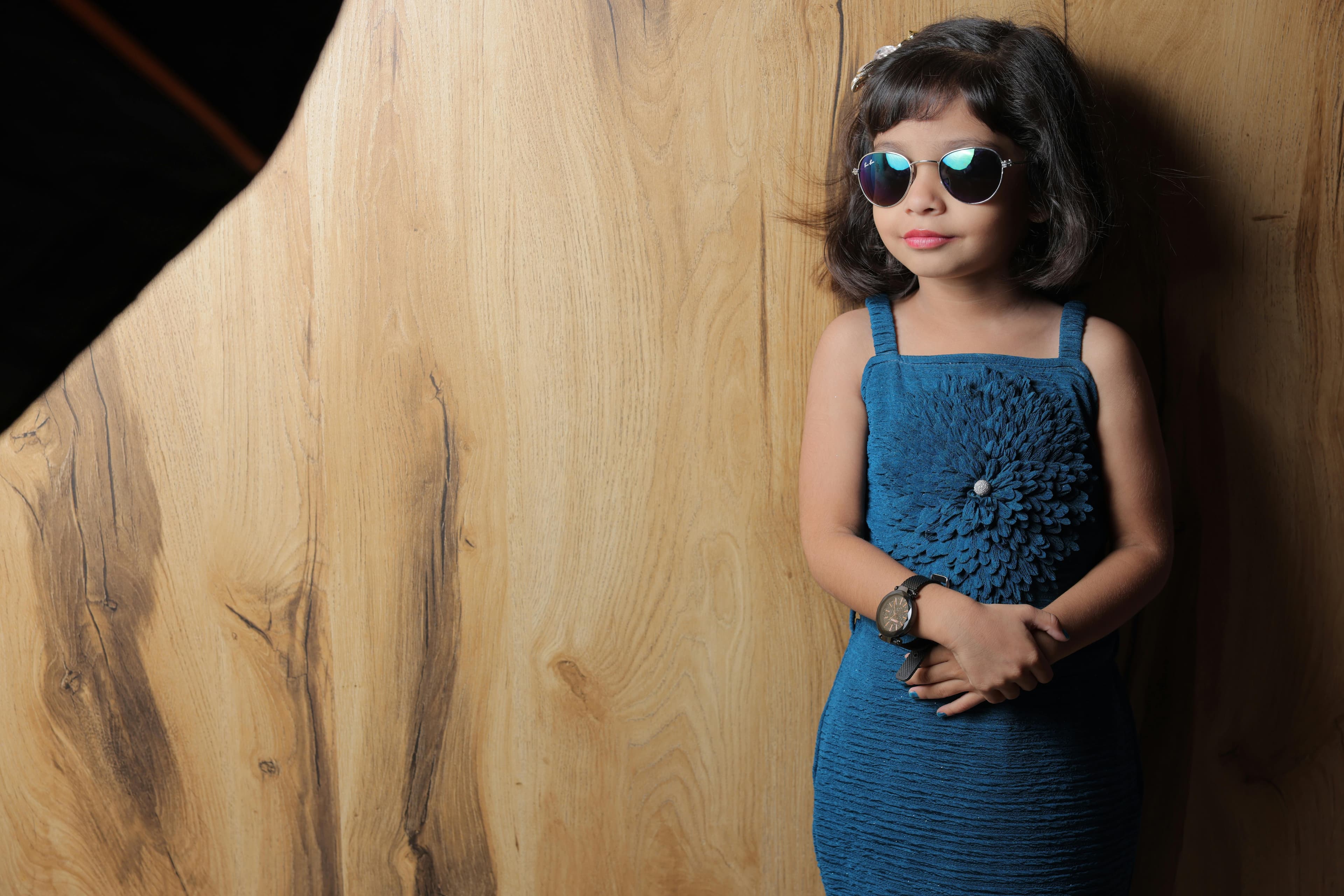Young child in a blue dress
